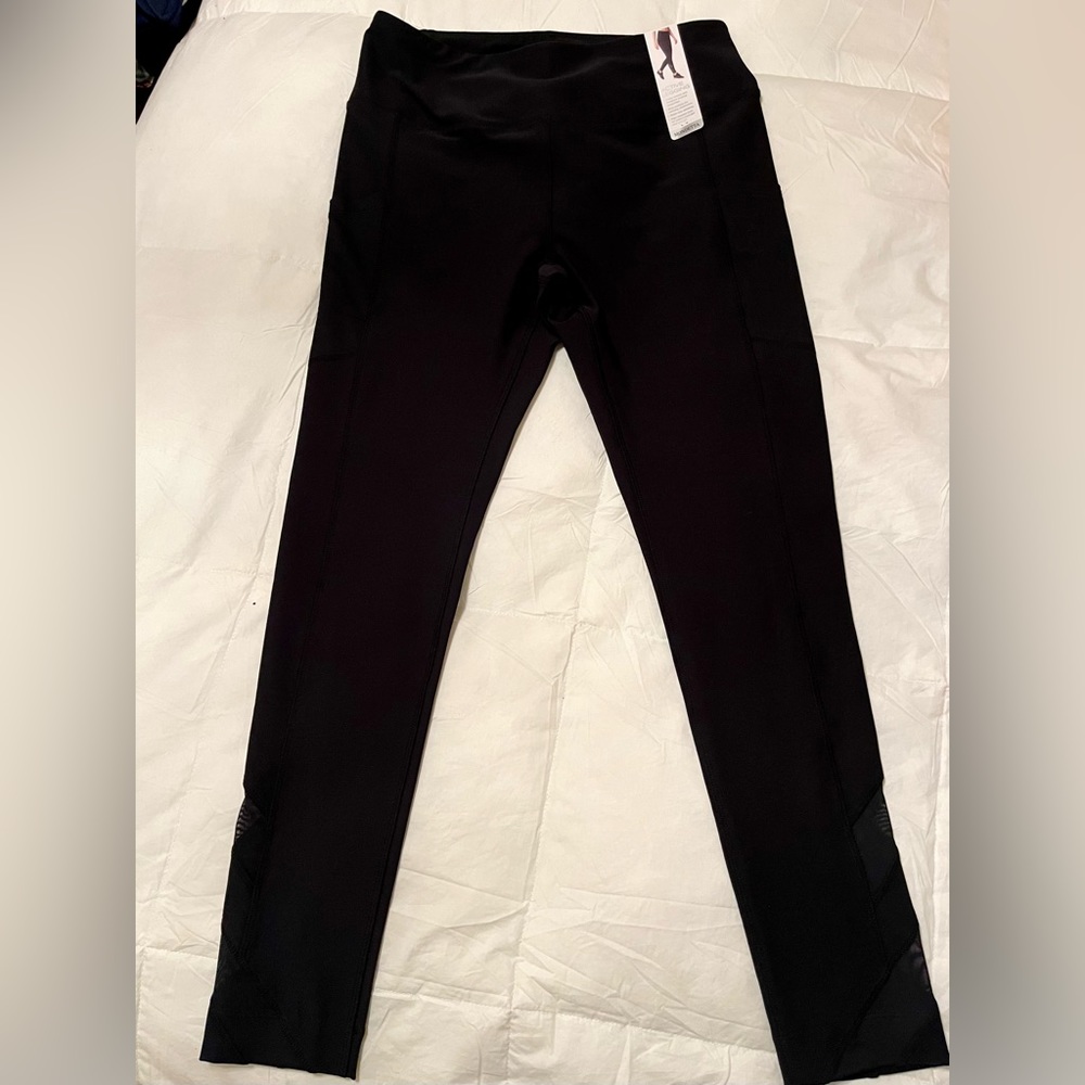High waist Mondetta leggings, laser net trim at ankle and side pockets